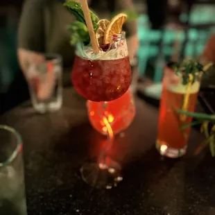 a drink with a straw and garnish