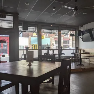 a view of a restaurant with tables and chairs
