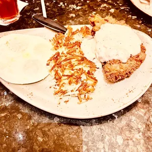 Chicken fried steak and eggs and gravy