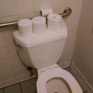 a toilet in a public restroom