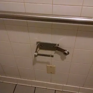 a toilet in a public restroom