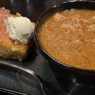 Gumbo, cup with slice of cornbread.