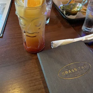 13$ orange mai tai drink tiki man. Wasn't strong at all. Mostly tasted like OJ