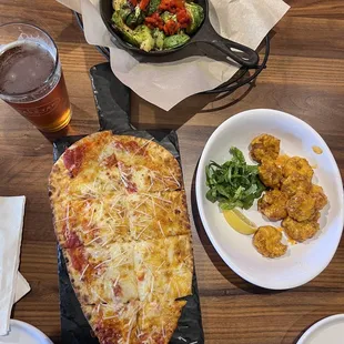 a pizza, salad, and beer