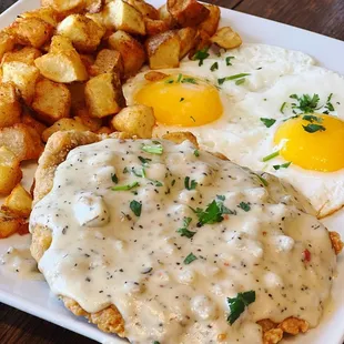 6oz Sirloin Breaded Steak Fried with Homemade Country Sausage Gravy. 2 Eggs Cooked Your Way Roasted Potatoes And Your Choice Of Toast.