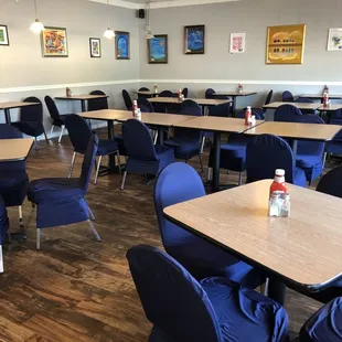 Dining area and local art for sale on the walls.