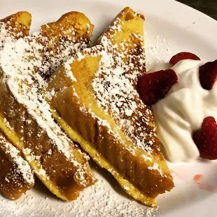 french toast with whipped cream and strawberries