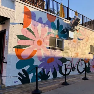 a colorful mural on the side of a building