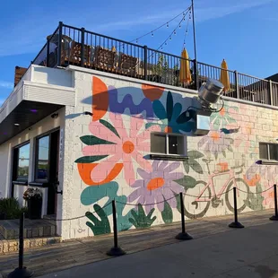 Great looking mural. And the rooftop!