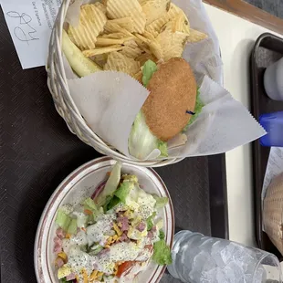 a plate of chips and a bowl of salad