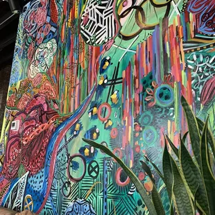 a colorful mural in a living room