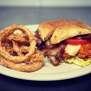 a sandwich and onion rings
