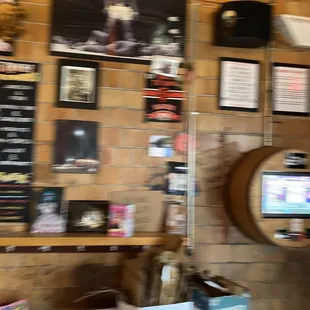 a bar with a wall full of menus