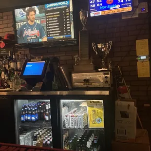 a bar with a large screen tv