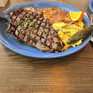 Ribeye steak, scrambled eggs and hashbrowns