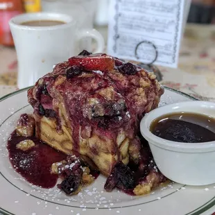 a plate of french toast and a cup of coffee