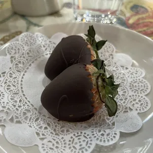 two chocolate covered strawberries