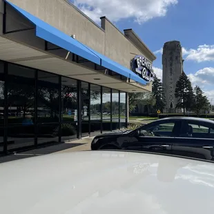 a car parked in front of the restaurant