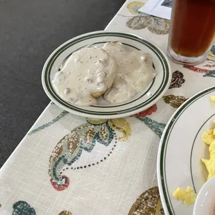 two plates of food and a drink