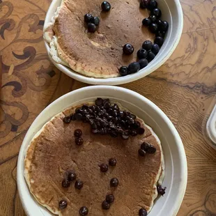 Chocolate chip pancake $11 (bottom) + blueberry pancake $11(top)