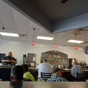 people sitting at tables in a restaurant