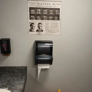 a newspaper dispenser on the wall