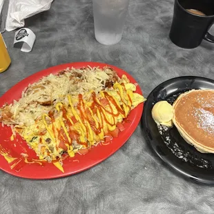 Farmers skillet with side of hash brown and pancake.