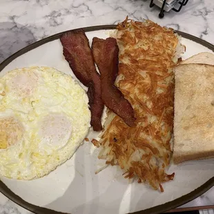 The Sky River Combo with eggs over medium and sourdough bread.