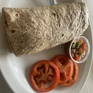 a burrito and tomatoes