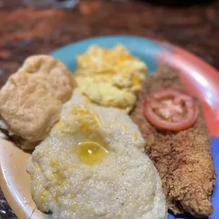 Cheese grits, eggs and fried fish