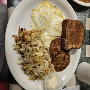 Egg over medium, hash browns, wheat toast