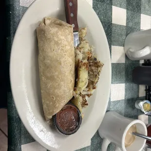 Sausage egg and cheese burrito with hash browns.