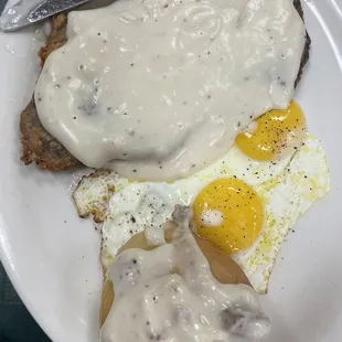 County Fried Steak, Sunny Side Eggs, and Biscuit with gravy