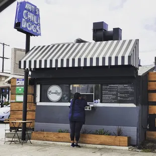 a woman standing at the counter