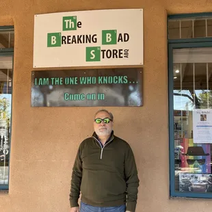 Store sign outside, husband