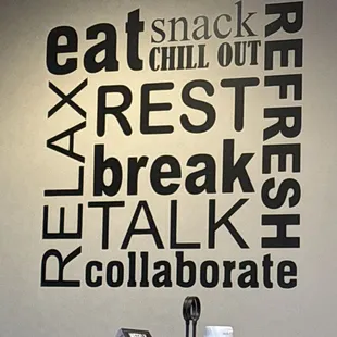 a coffee maker and a sign that says eat chill out