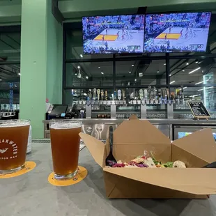 Watching the game while having a beer.