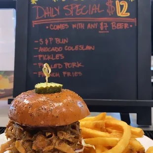 a pulled pork sandwich and fries