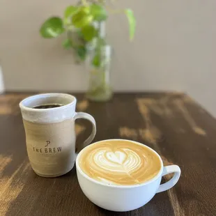 a cup of coffee and a mug of coffee