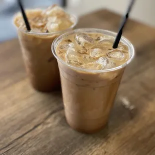 two cups of iced coffee on a table