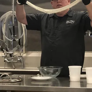 Mark showing how to stretch the mozzarella.