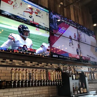 a sports bar with multiple televisions
