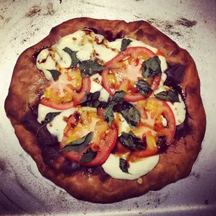 Spent grain pizza crust with caprese toppings