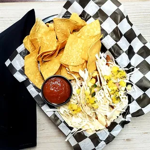 a plate of nachos and chips