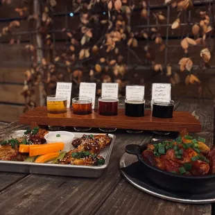 A flight (obvi), teriyaki wings, and bratwurst over mashers!