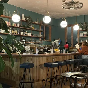 a woman sitting at a bar