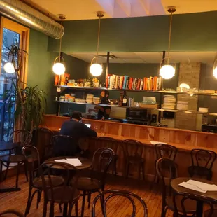 looking behind from the bar to he kitchen