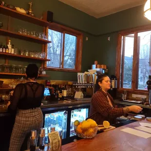 north wall, NE corner, behind the bar