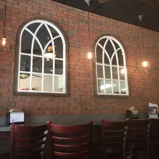 a brick wall with arched windows