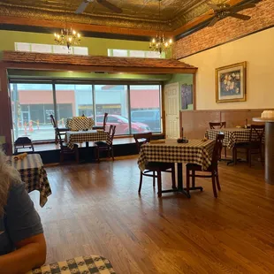 a dining room with tables and chairs